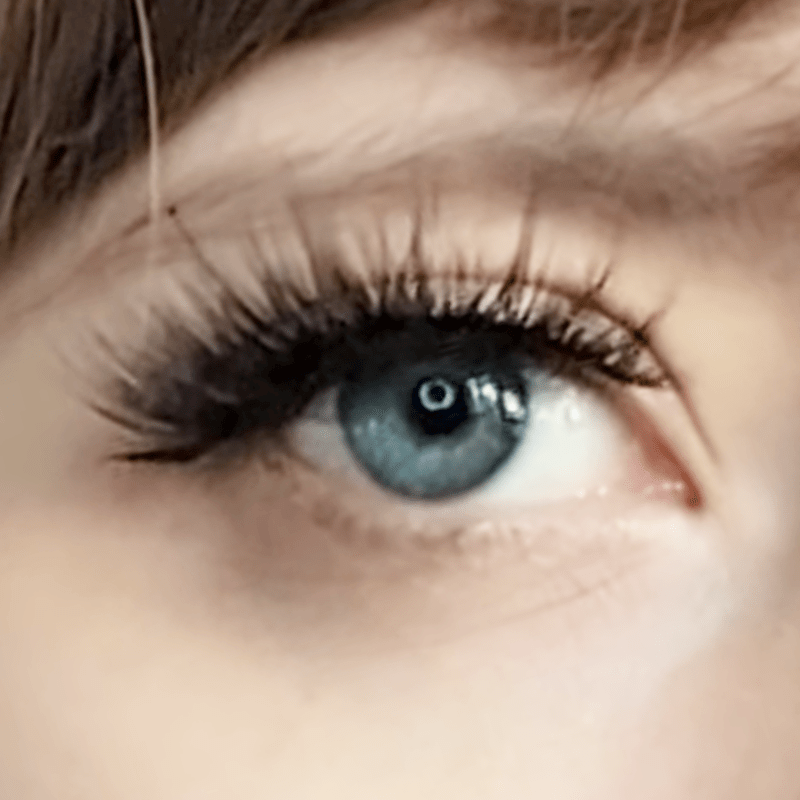 Volumising long strip lashes on a model's eye.